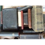 A number of bibles and prayer books along with an album of early 20th century family portraits (12)