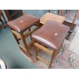 A pair of oak stools,