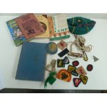 A selection of boy scouts items, including a cap,