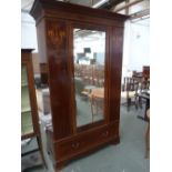 An Edwardian mahogany wardrobe, by Maples, mirrored door,