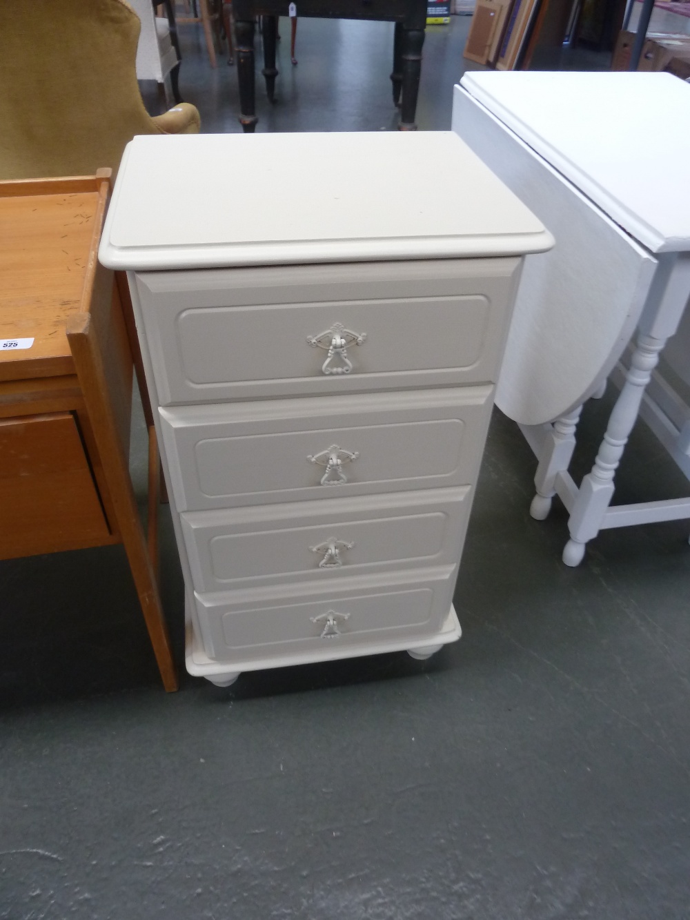 A 20th century painted four drawer chest,