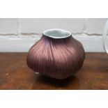 A Rosenthal studio line china vase by Martin Freyer in the form of a stylised garlic with metallic