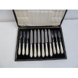 A set of six 20th century stainless steel and mother of pearl handle knife and forks, by W.H&S.