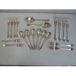 A set of six silver plate dinner forks, dessert forks and dessert spoons, with two dinner spoons,