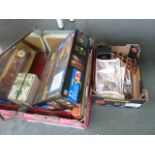 Two boxes of board games and puzzles including vintage naughts and crosses, Monopoly Deluxe,