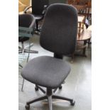 A black upholstered adjustable office chair