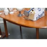 A modern extending oval dining table,
