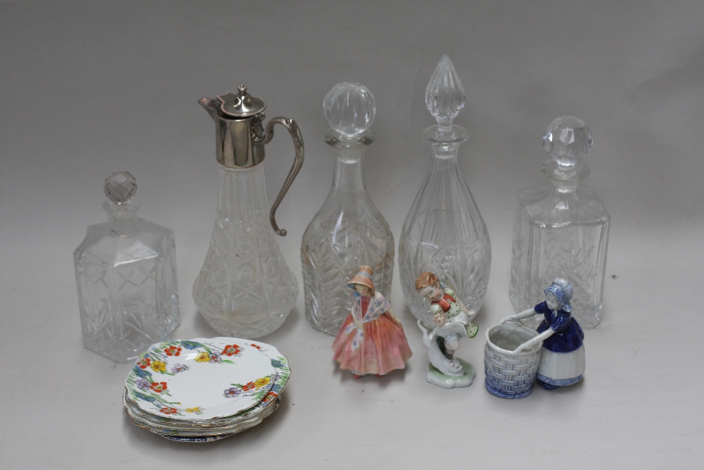 A quantity of glassware and ceramics to include various cut glass decanters and stoppers,