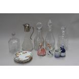 A quantity of glassware and ceramics to include various cut glass decanters and stoppers,