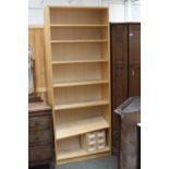 A modern tall bookshelf with seven shelves 80cmW x 202cmH with a small six drawer storage chest