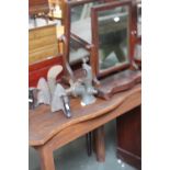 A vintage meat grinder, two flat irons,