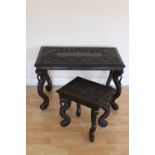 Two Chinese hardwood tables carved with foliage and birds over cabriole carved legs,