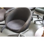 A black upholstered tub chair