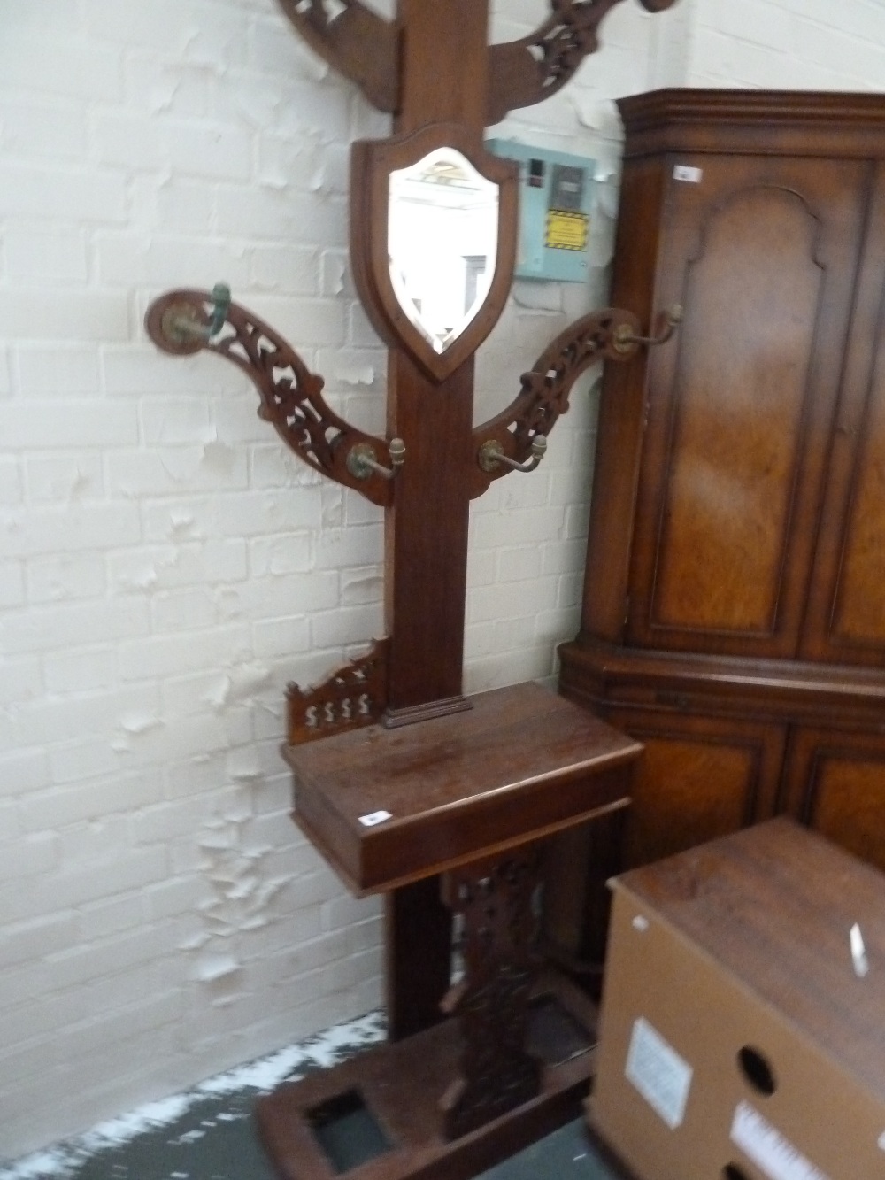A Victorian walnut hall stand, with four pierced arms above a glove box and umbrella stand base, - Image 2 of 3