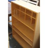 A modern shelf unit with an arrangement of eight small pigeon holes over three shelves 80cmW x