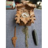 Bachmaier and Klemmer carved cuckoo clock with weight in the form of a pine cone with a Barometer