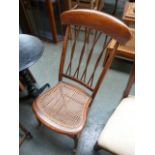 A Victorian childs spindle back rocking chair