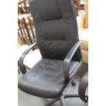 A black faux leather adjustable office chair