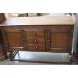 A 17th century style oak sideboard,