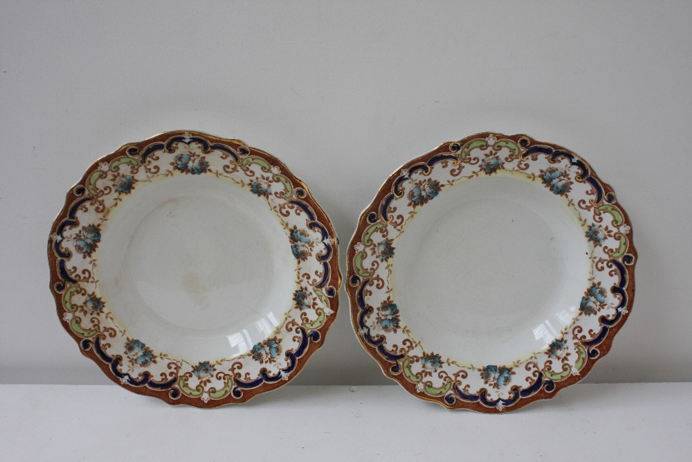 Two Myott and Sons shallow bowls of transferred floral design heightened with gilt and blue and