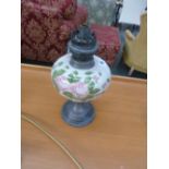 A 19th century French pewter and handpainted china lamp