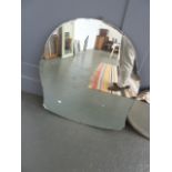 A large bulbous hanging mirror,