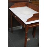 A Georgian washstand galleried top over two drawers on turned legs,