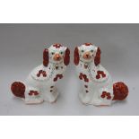 A pair of Arthur Wood Staffordshire flat back figurines of King Charles spaniels,