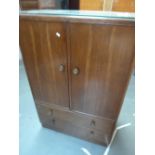 A mid century oak cupboard unit,