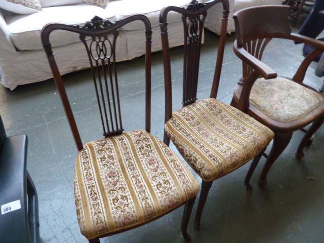 A pair of Edwardian mahogany fiddle back bedroom chairs,