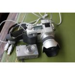 A Minolta Dimage 7i 5.0 mega pixels and a Canon Digital Ixus II 3.