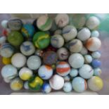 A box of 126 miscellaneous glass marbles ranging from 15mm to 3cm in diameter