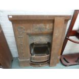 An Art Nouveau style cast iron fireplace, signed JIG to reverse,