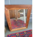 A 1950's oak framed tapering mirror with enamel ball decoration to both sides,