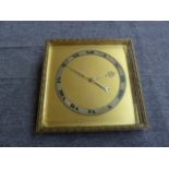 An Art Deco table clock, silvered dial, bevelled glass front (distressed),