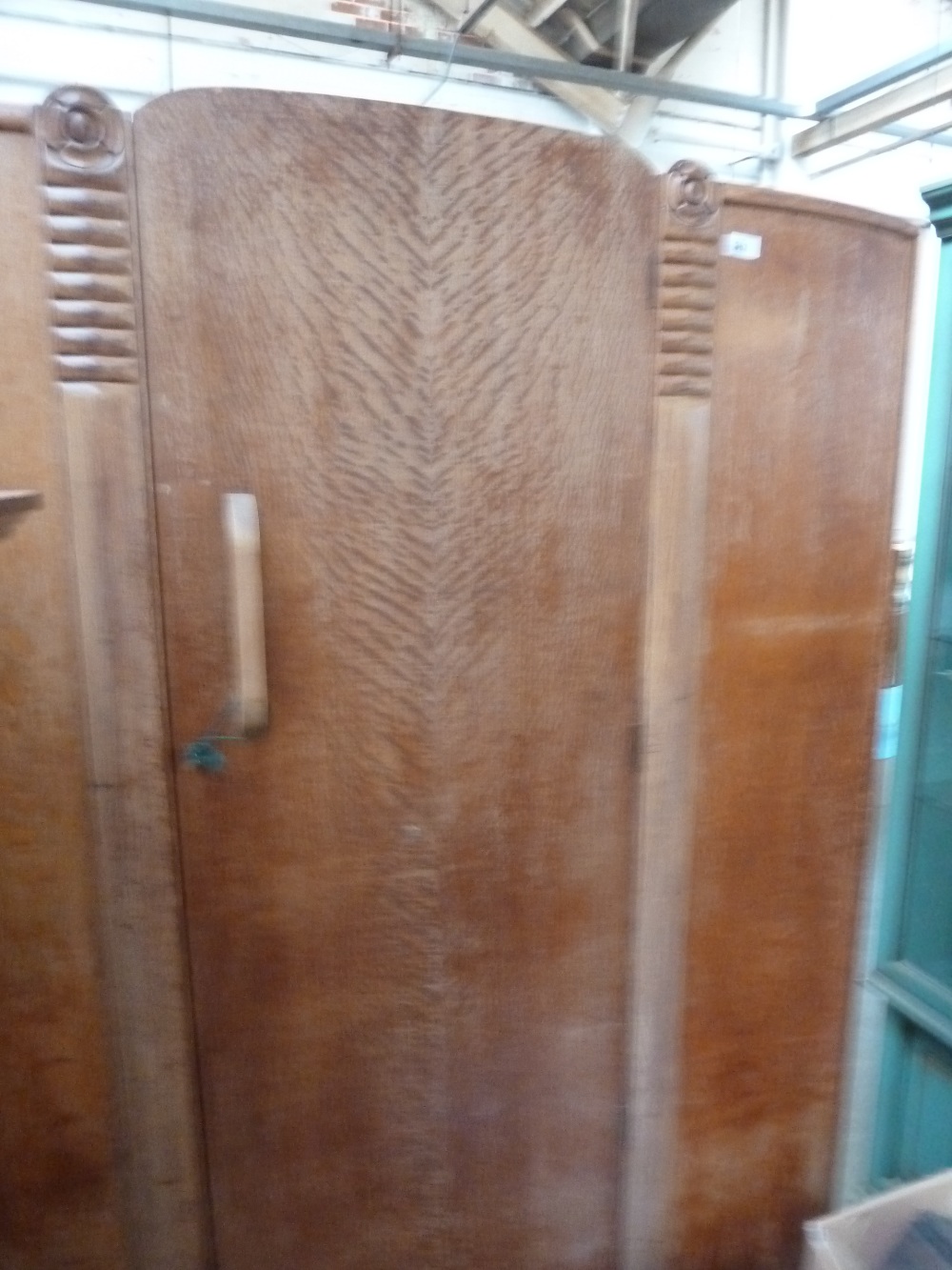 A 30's pine wardrobe, carved with roses,