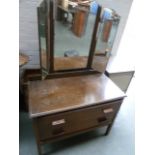 A 1950's oak dressing table with triple mirror and a rectangular top,