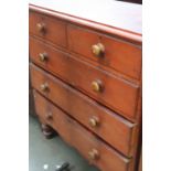 A Victorian pine chest with two short drawers and three long raised on turned toupie feet,