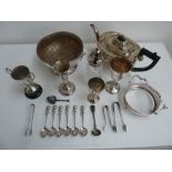 A number of silver plated items including a tea pot, trophies on plinths, cut glass castor, vase,