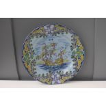 A large Portuguese Pottery platter decorated with a hand painted maritime scene, marked 'L.R.P.