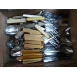 A large selection of silver and silver plated pieces of flatware, some with bone handles,