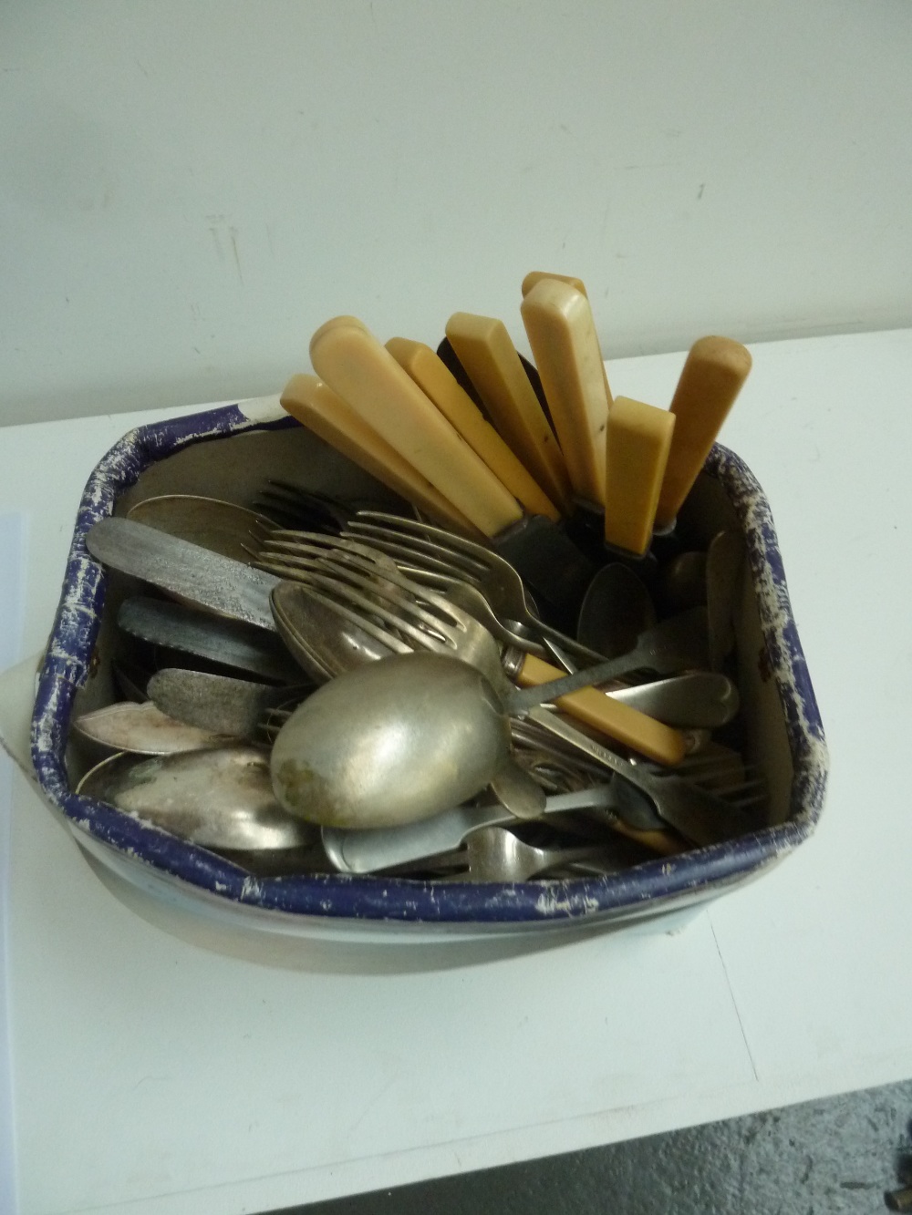A large selection of silver plated flatware, some with bone handles, including fish knife and forks,