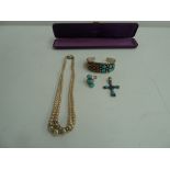 Three pieces of silver, turquoise and red agate jewellery, including bangle, ring and crucifix,