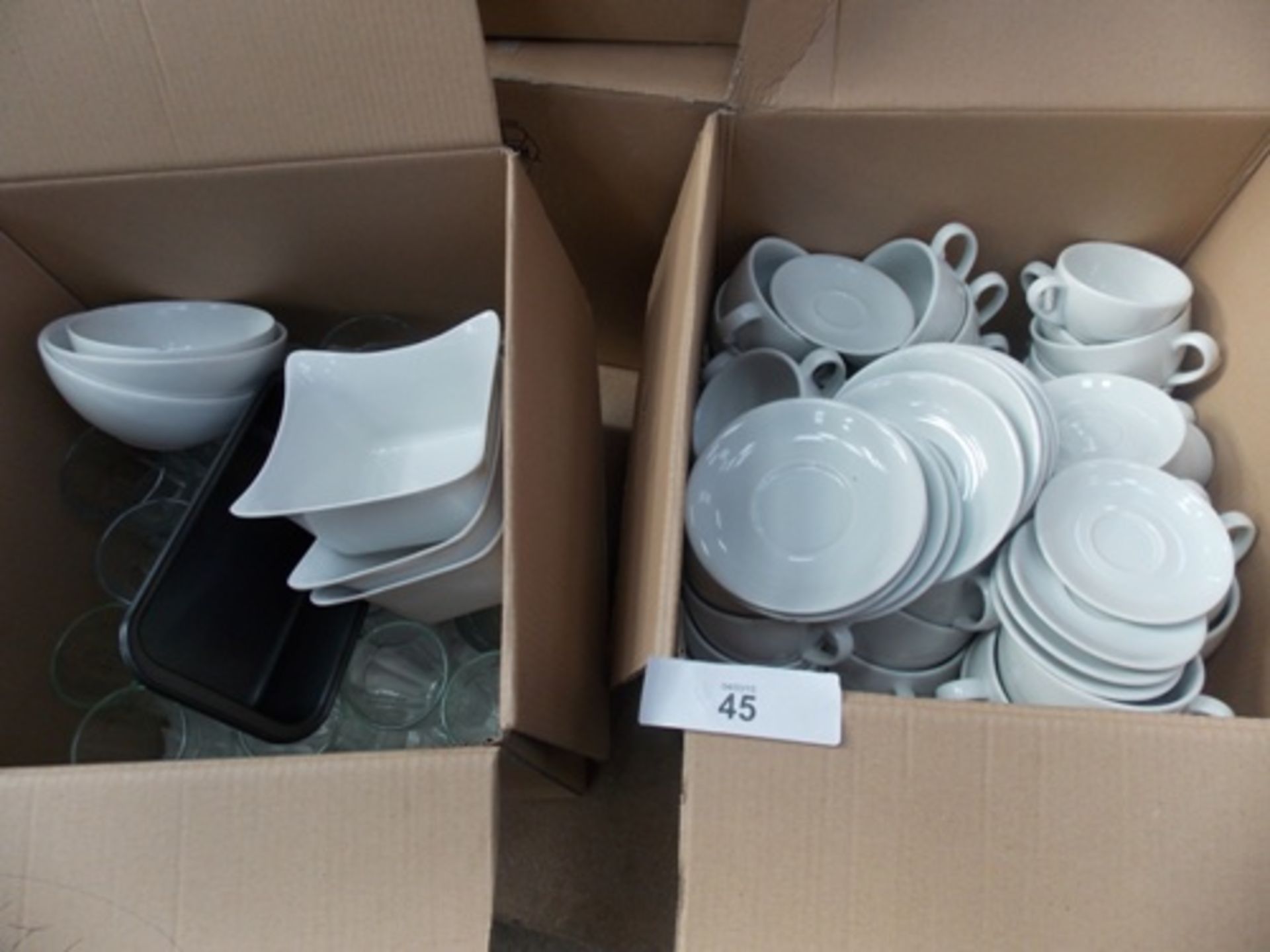 A good selection of modern pottery including plates, bowls, mugs and plastic ware