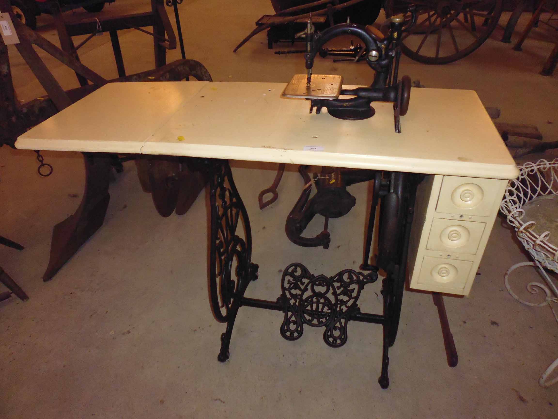 A late 1800's Willcox & Gibbs treadle operated sewing machine, complete with the original