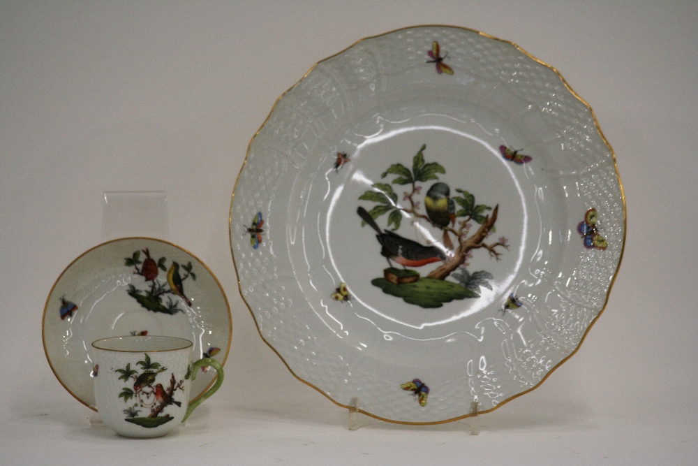 A quantity of Herend porcelain dinner and tea ware, profusely decorated with birds,