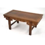 A Chinese hardwood low table, decorated frieze, raised on square section stretchered supports,