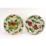 Four continental faience style plates, with brightly coloured floral enamel decoration, 20cm dia.