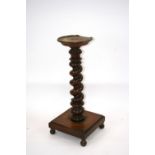 A 19th Century mahogany jardinière stand, raised on spiral turned column,