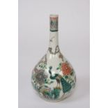 A Chinese famille verte bottle vase, decorated with exotic birds and foliage,